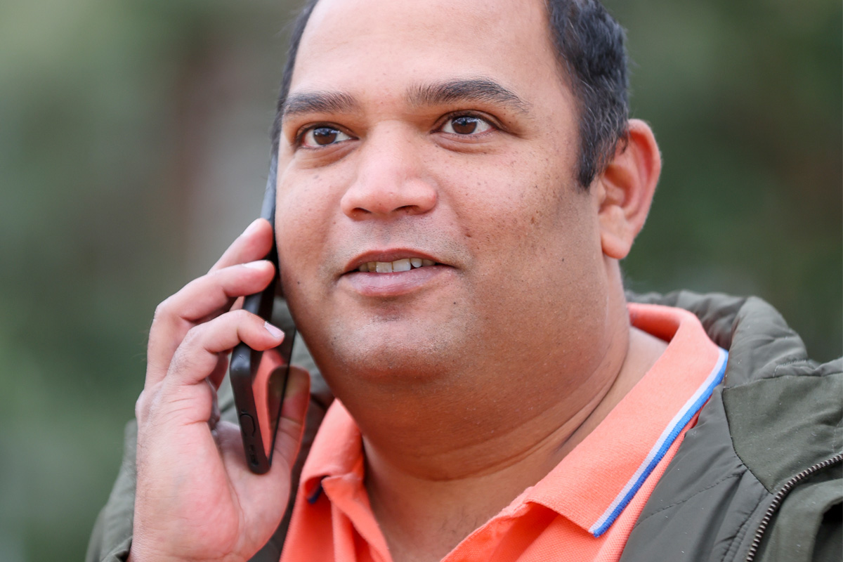 A man holding a telephone to his ear